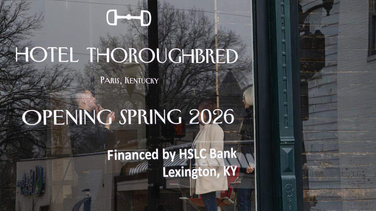 Co-Owners Andy Embry, Jan Moncivaiz and Debbie Poynter hold a meeting in the lobby area of Hotel Thoroughbred, a 19-room boutique hotel undergoing restoration in downtown Paris, Ky, on Dec. 4, 2025.