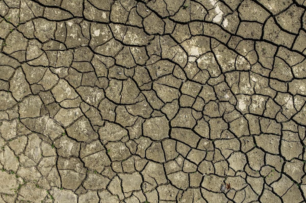 Mud covers a tennis court at the Homeplace Community Center property in Perry County, Ky., on Tuesday, Aug. 23, 2022, following flash flooding that devastated parts of Eastern Kentucky in late July.