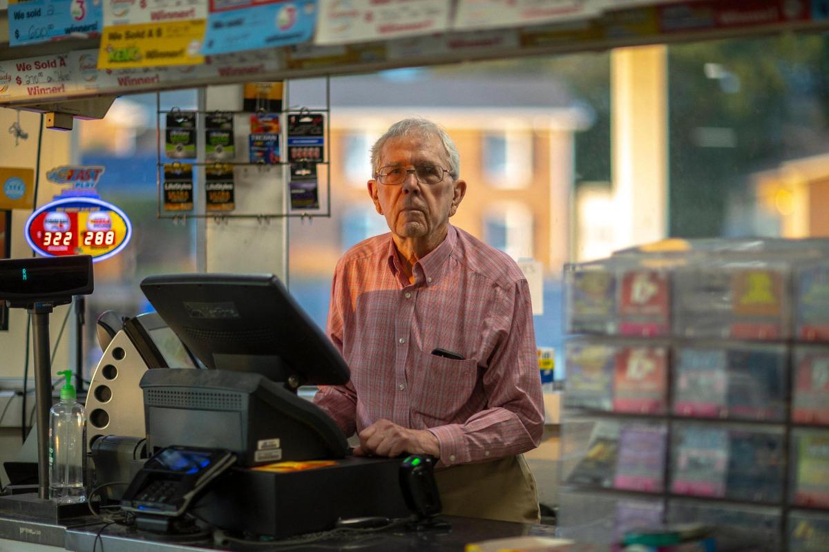 Eddie White, 84, poses for a portrait in the Dairy Mart he owns on East Reynolds Road in Lexington, Ky., on Friday, Aug. 27, 2021. White is closing his store, the last Dairy Mart in Lexington, on Saturday, Aug. 28, 2021. His store is one of the top lottery ticket sellers in the state.