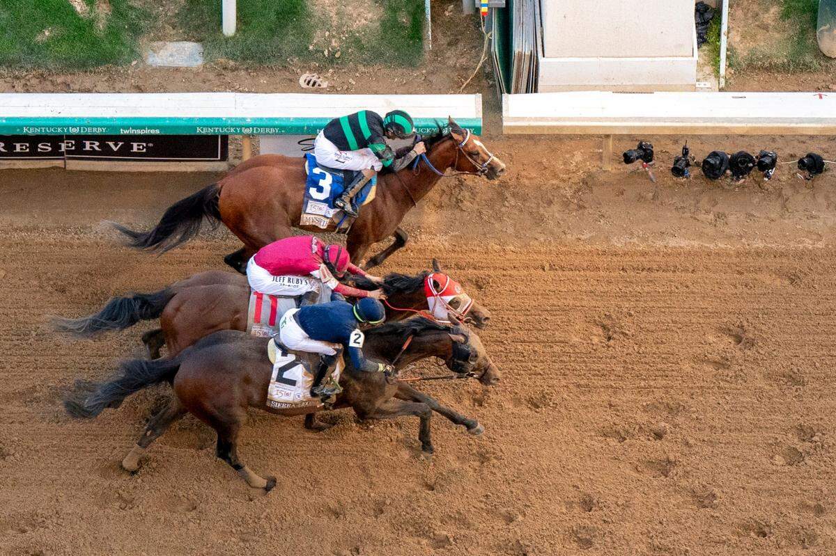 Mystik Dan, top with Brian Hernandez Jr. aboard, wins the 150th Kentucky Derby in a photo finish.