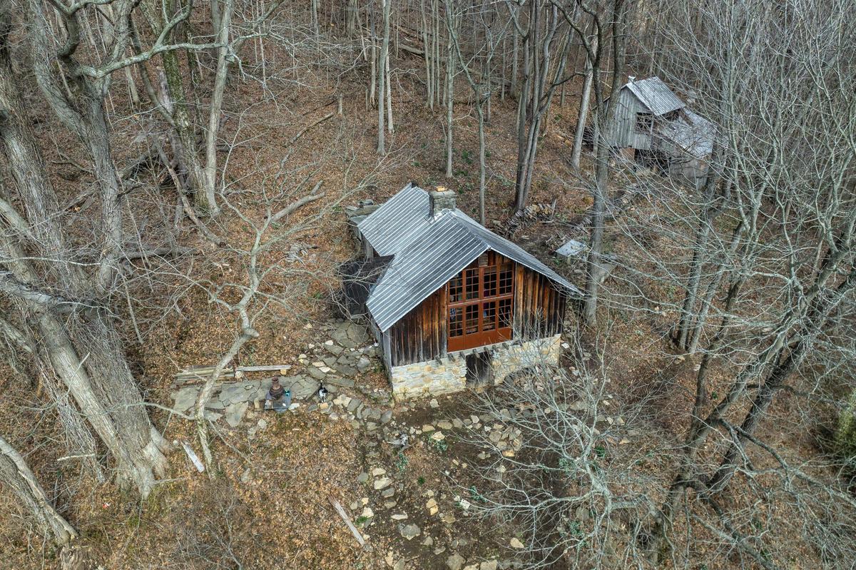 The residence, left, and studio at Payne Hollow are photographed in Trimble County, Ky., on Thursday, March 6, 2025. Harlan and Anna Hubbard lived off their land in a very remote and sustainable way for about 40 years at Payne Hollow.