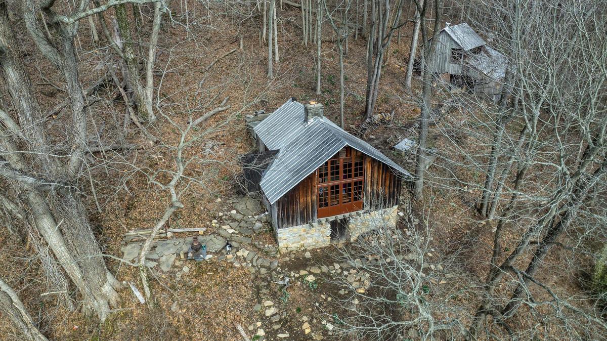 The residence, left, and studio at Payne Hollow are photographed in Trimble County, Ky., on Thursday, March 6, 2025. Harlan and Anna Hubbard lived off their land in a very remote and sustainable way for about 40 years at Payne Hollow.