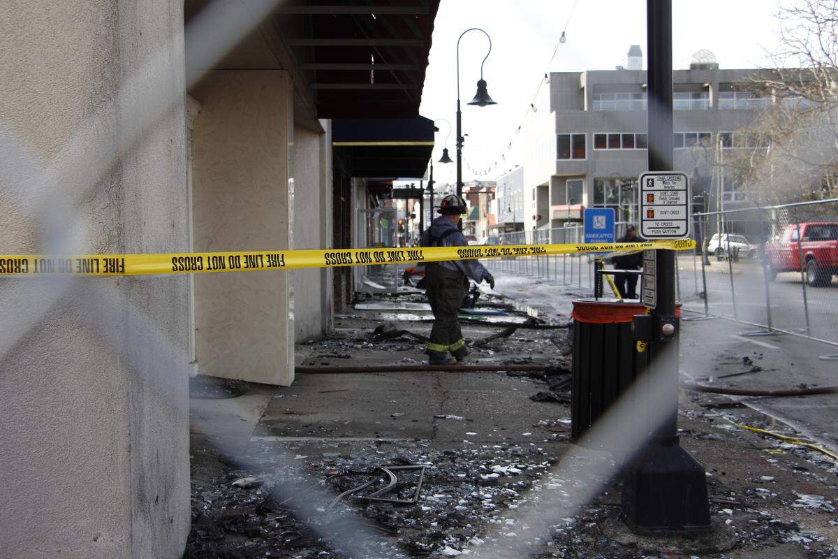 Williamsburg, Ky., Assistant Fire Chief Troy Thomas exits a burned-out building near the site of an overnight blaze that destroyed portions of the historic downtown core Jan. 20, 2026.