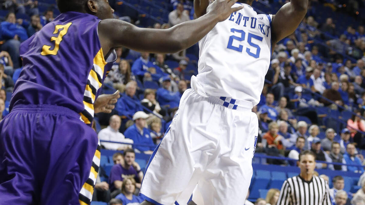 Kentucky Wildcats guard Dominique Hawkins (25) put up a shot over Montevallo's Shykeem Jackson,3,  as Kentucky defeated Montevallo 95-72 on Monday November 4, 2013 in Lexington, Ky. Photos by Mark Cornelison | Staff