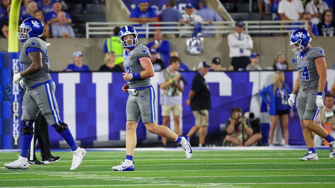 Kentucky quarterback Brock Vandagriff, center, runs off the field after a first-half fumble against Georgia. Vandagriff completed 14 of 27 passes for 114 yards on Saturday night and was sacked three times.