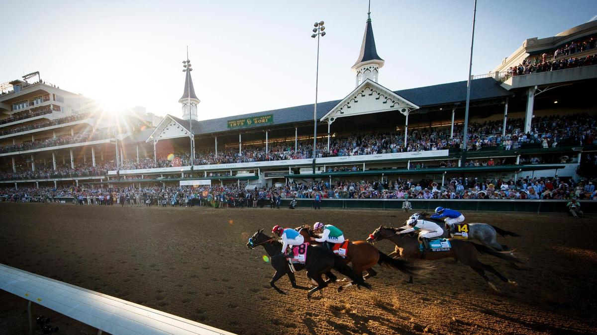 Medina Spirit (8) with John R. Velazquez up, leads heading into the final stretch of the 147th running of the Kentucky Derby at Churchill Downs in Louisville, Ky., Saturday, May 1, 2021. Medina Spirit won but was later disqualified for a failed drug test and tragically died not long after.