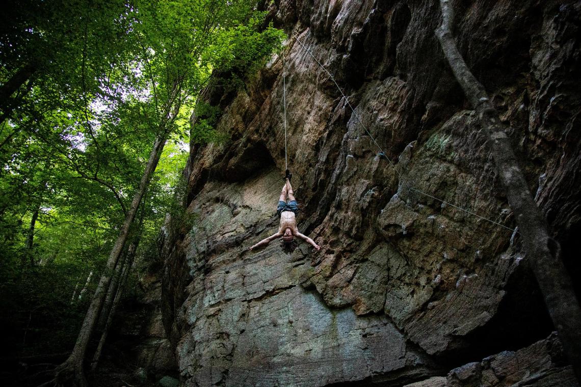 Oliver Vickers Batzdorf, 19, descends after completing a route climbing July 14 at Red River Gorge. Many of Miguel’s employees are seasonal climbers who come to Red River Gorge to enjoy the climbing.