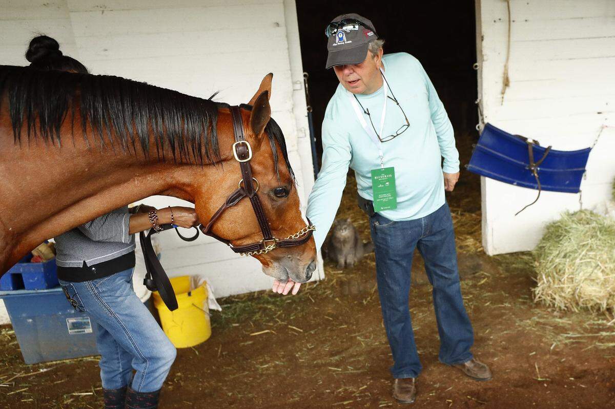 Chester Thomas of Madisonville greeted By My Standards in their barn at Churchill Downs last year. By My Standards finished 12th in the 2019 Derby.