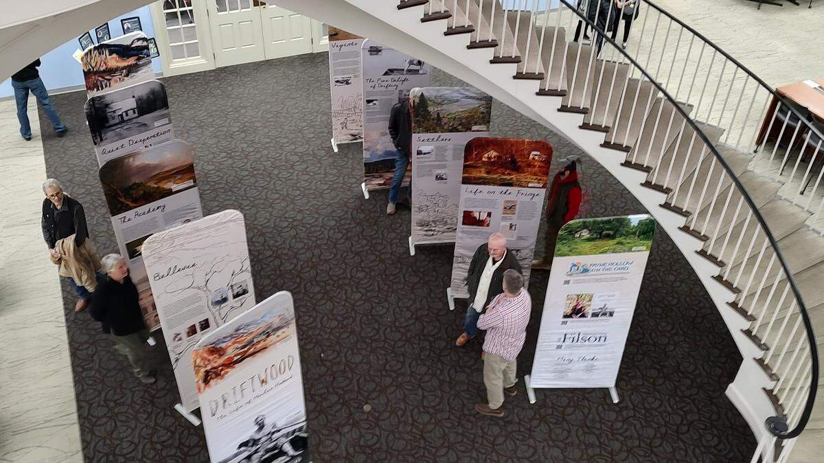 Visitors to the library at Hanover College in Madison, Ind., perused a display of panels about the life of Harlan Hubbard. Hubbard and his wife, Anna Hubbard, had a longstanding relationship with the college, and Payne Hollow on the Ohio, the nonprofit committed to preserving their homeplace, is working to reconnect.