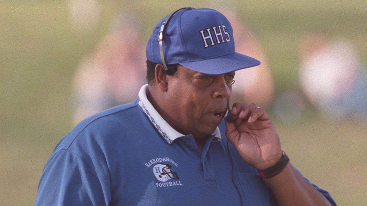Alvis Johnson led the Harrodsburg High School football team to a record of 194-77 and three state runner-up finishes across 23 seasons. His track and field teams won numerous state championships, and he also taught and served as athletics director at the school.