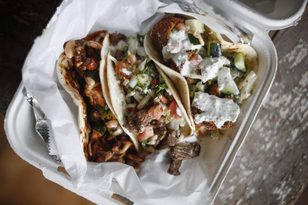 A three taco combo including the Shogun Taco, The Gringo Taco and the Falafel Taco at Bazaar Eatery located inside Ethereal Brewing Public House in downtown Lexington.