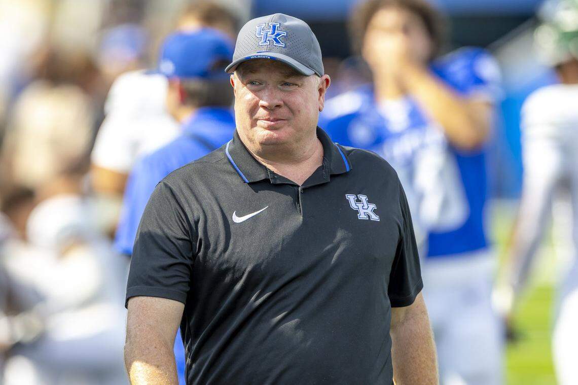 Kentucky head coach Mark Stoops walks off the field following Saturday’s win Ohio at Kroger Field.
