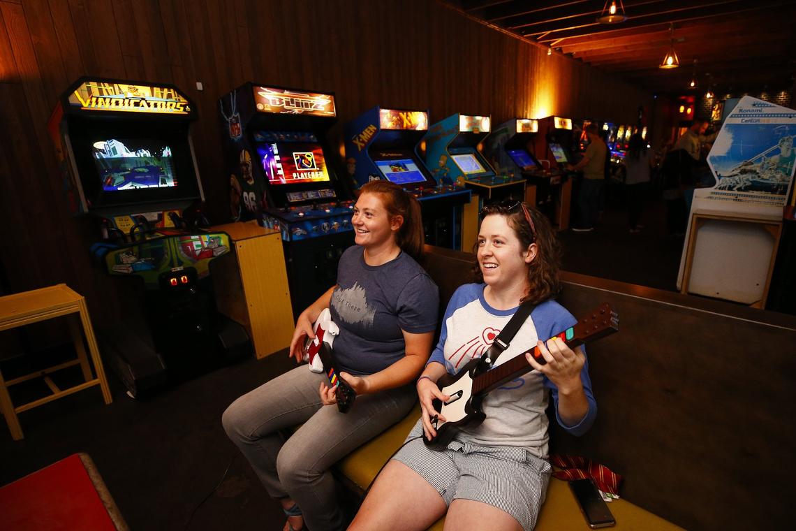 Rebecca Sweet, left, and Mikayla Rogers, both of Lexington, played Guitar Hero Thursday at the Burl Arcade in Lexington.  The Burl Arcade offers a variety of retro games including Pac-Man, Galaga, skee ball and pinball.