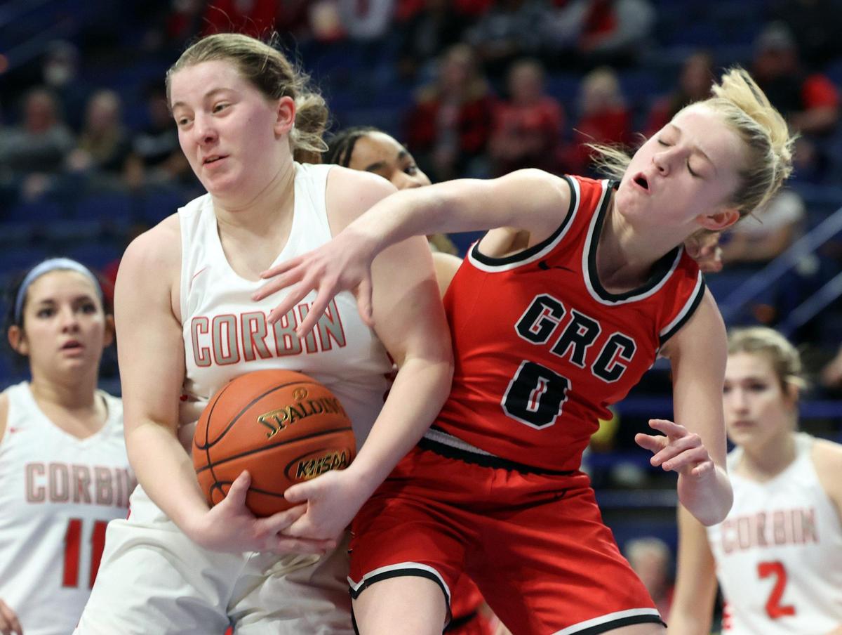 Clark County’s Kennedy Stamper (0) battles Corbin’s Raegan Walker for a rebound Thursday night in Rupp Arena.