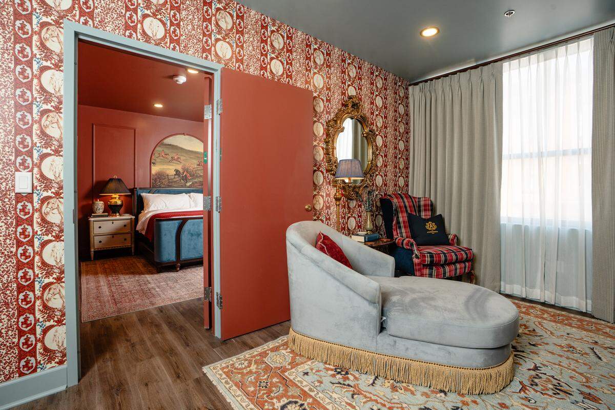 The parlor sitting room for a Deluxe King room at The Aldenberg Hotel comes with panoramic views of historic downtown Versailles, Ky. Room rates for a Deluxe King room range from $200-$245 a night.