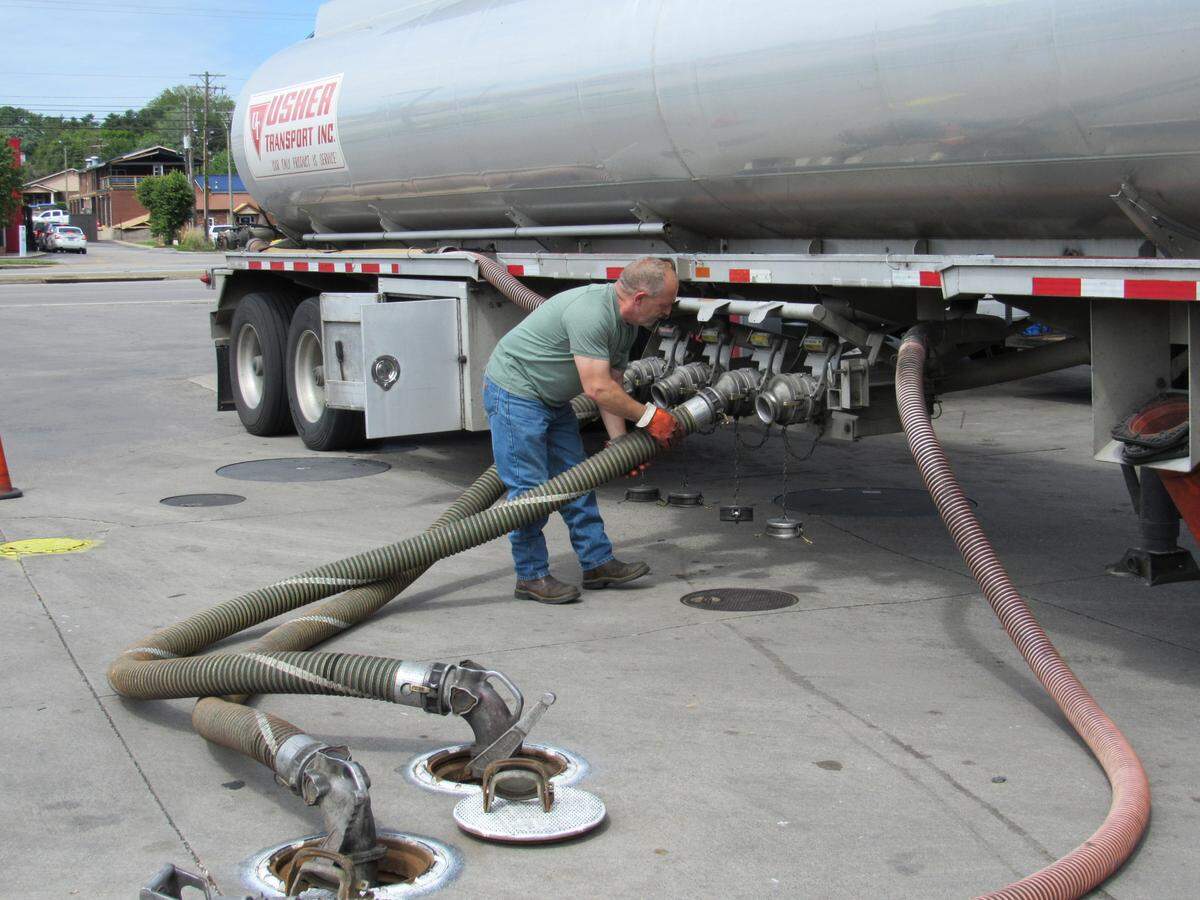 Allen Elliott, who drives a gasoline tanker truck for Usher Transport, filled up storage tanks at a Speedway convenience store in Somerset, Ky. on May 5, 2021.
