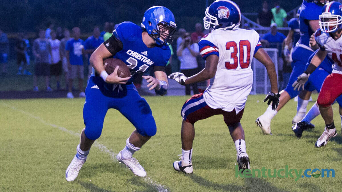 LCA's Nick Whitman looked for a running lane as Lexington Christian Academy hosted Christian Academy of Louisville on Saturday August 23, 2014 in Lexington, Ky.  Photo by Mark Mahan