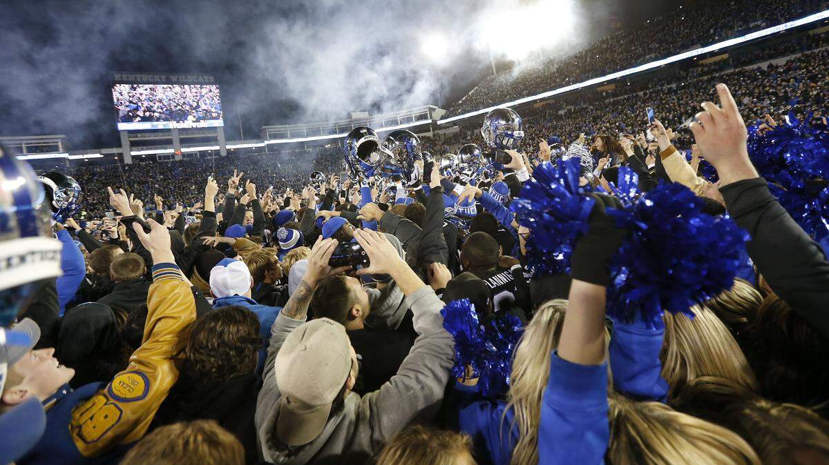Fans and players celebrated as the University of Kentucky defeated  the University of South Carolina at what is now Kroger Field on Oct. 4, 2014.
