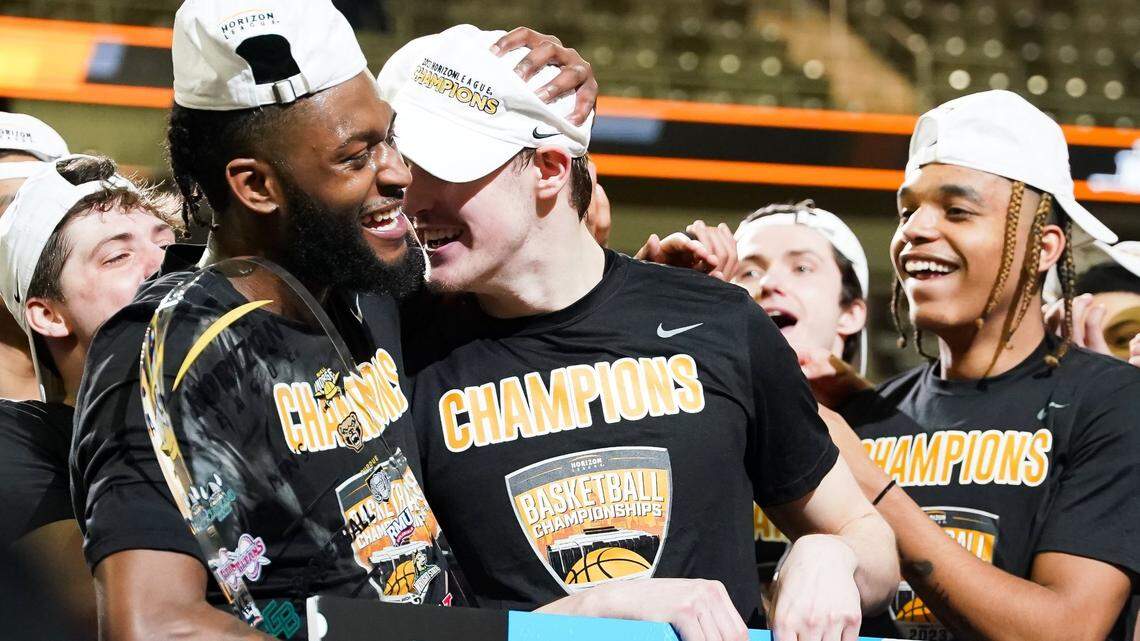 Former Mercer County High School star Trevon Faulkner, left, and ex-Fort Thomas Highlands star Sam Vinson, center, celebrated after they helped lead Northern Kentucky to a 63-61 win over Cleveland State in the Horizon League Tournament finals Tuesday night.