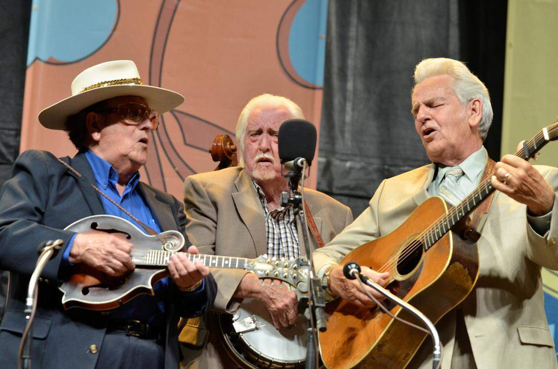 From left, Bobby Osbourne, J.D. Crowe and Del McCoury gathered around the microphone at the 2013 Festival of the Bluegrass at the Kentucky Horse Park.
