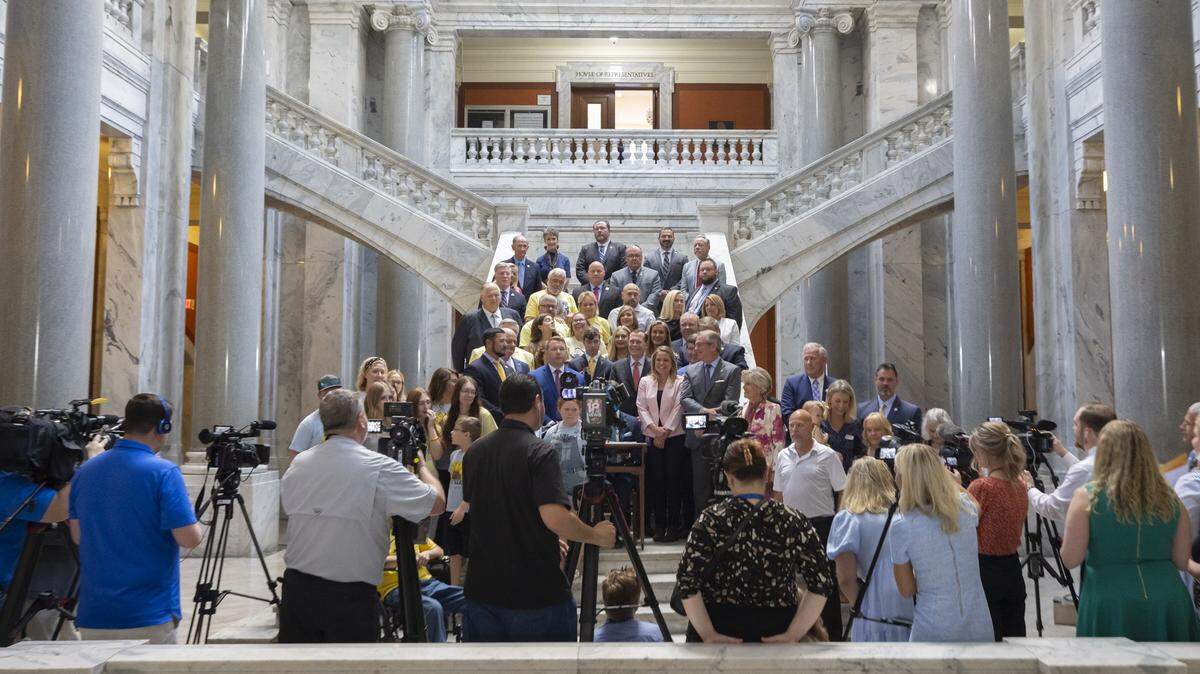 Sponsors and supporters of House Bill 5, the Safer Kentucky Act, attend a ceremonial bill signing by Kentucky Secretary of State Michael Adams at the Kentucky state Capitol in Frankfort, Ky., on Monday, April 15, 2024. The bill was vetoed by Gov. Andy Beshear before the legislature overturned the veto.
