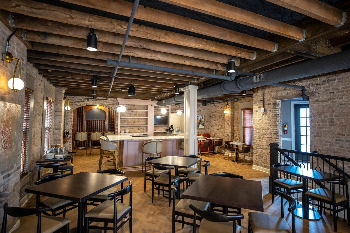 The upstairs dining room at Vallozzi’s has space at the back with wine and bourbon lockers.