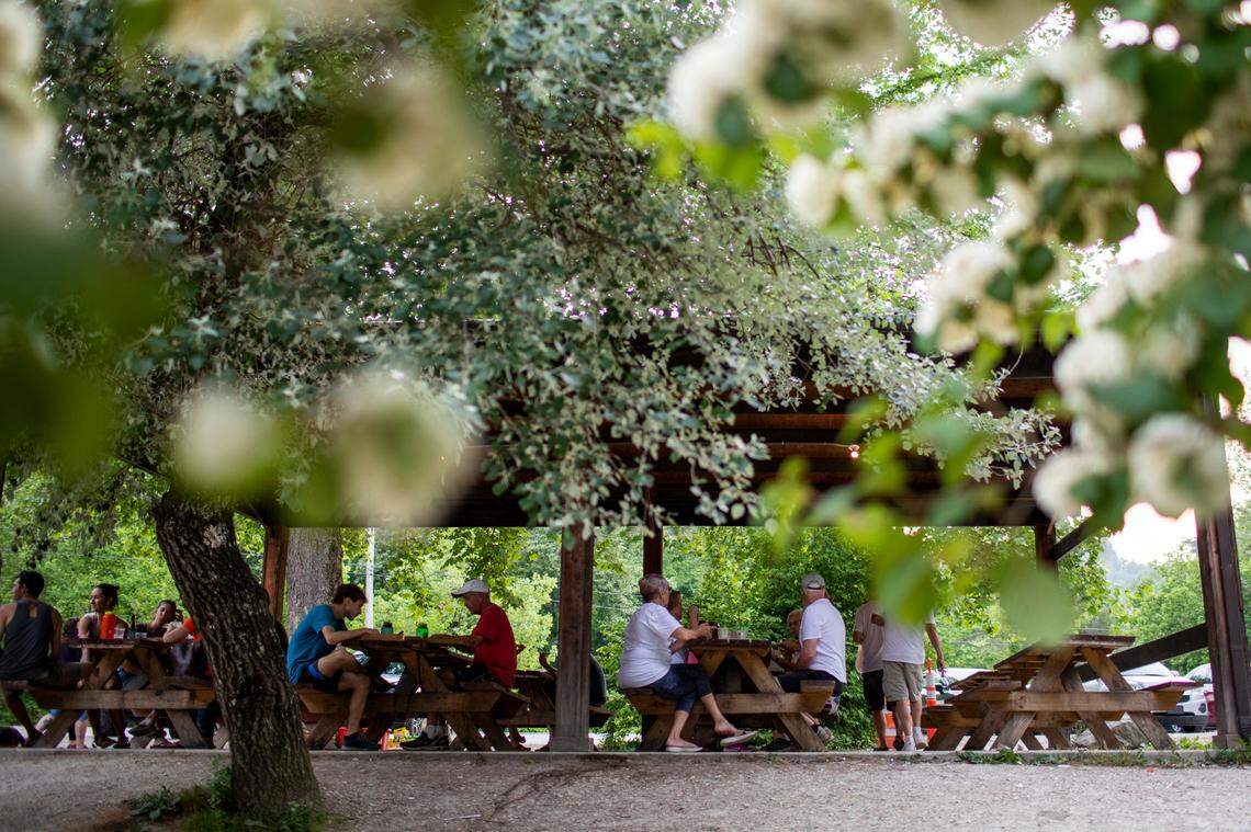 Patrons eat food and socialize outside of Miguel’s Pizza in Red River Gorge on Monday, May 24, 2021.