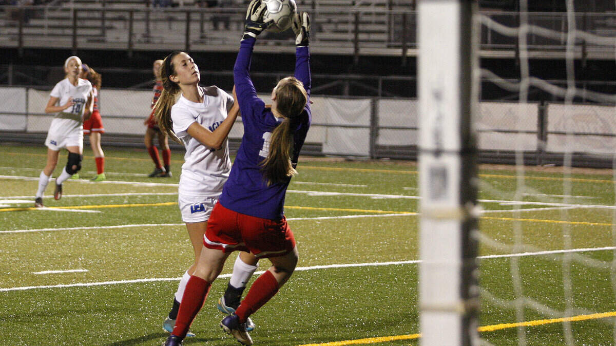 Lafayette keeper Kate Heinonen made a save as LCA's Peyton Nagle pressured in 43rd District play.  