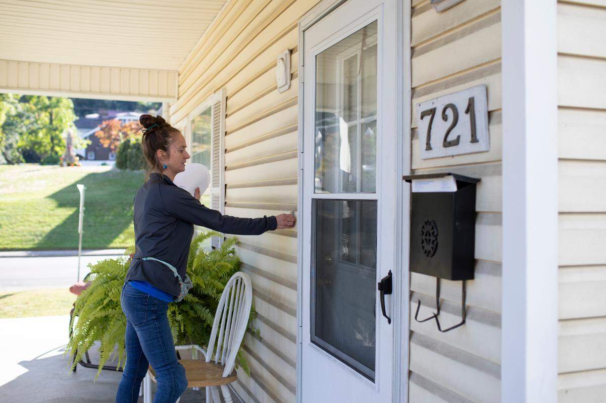Shawna McCown canvases in neighborhoods for Protect Kentucky Access in Ashland, Ky., Thursday, September 29, 2022.