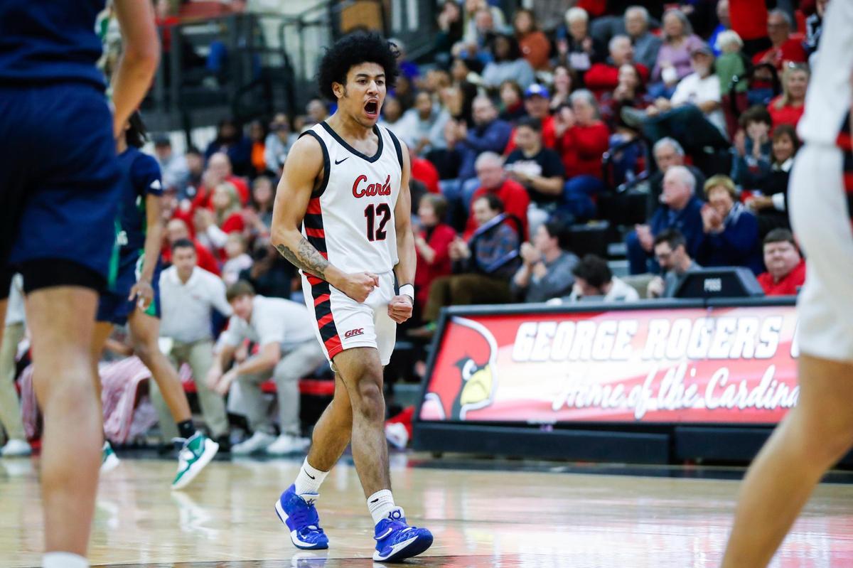 George Rogers Clark guard Sam Parrish (12) celebrates a three-point basket against Great Crossing during the Cardinals’ win in Winchester on Thursday night. The victory avenged a loss to the Warhawks earlier this season.