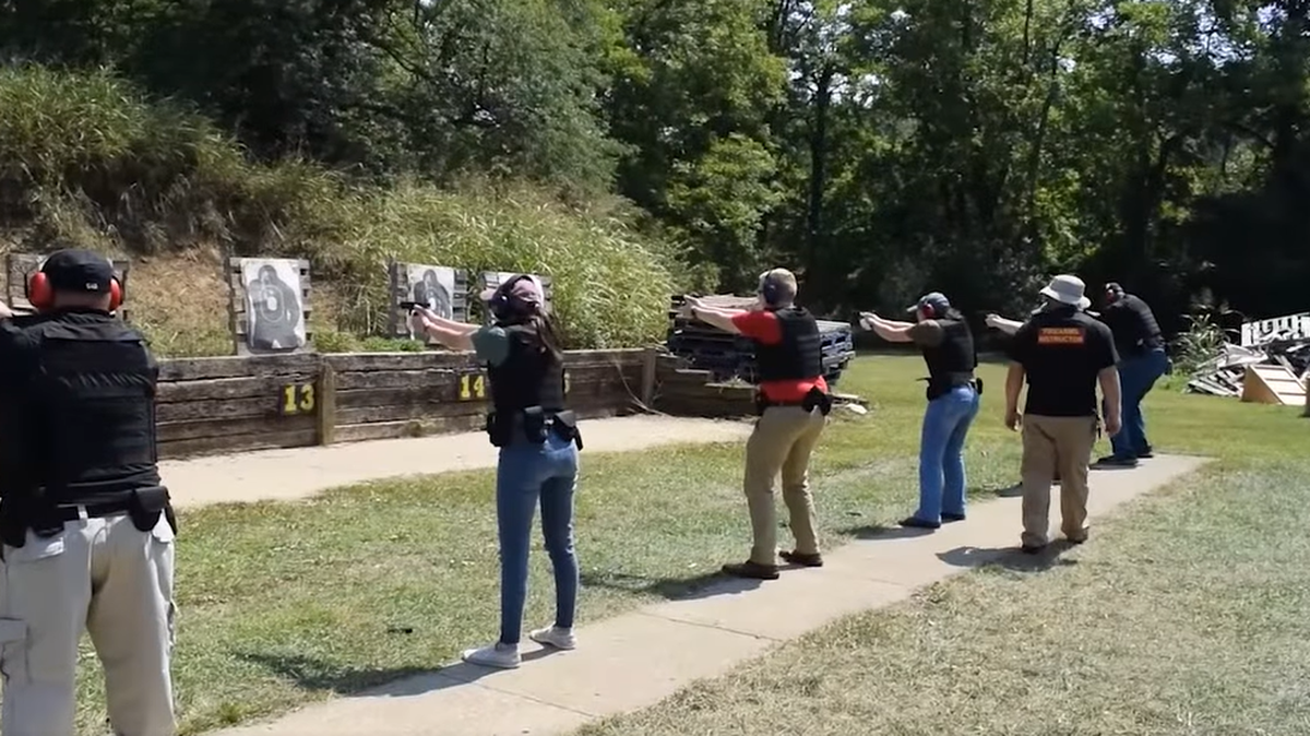 Kentucky probation and parole officers practice their shooting in 2022. The officers are sworn law enforcement agents who carry badges and guns and have arrest authority over offenders on their caseloads.