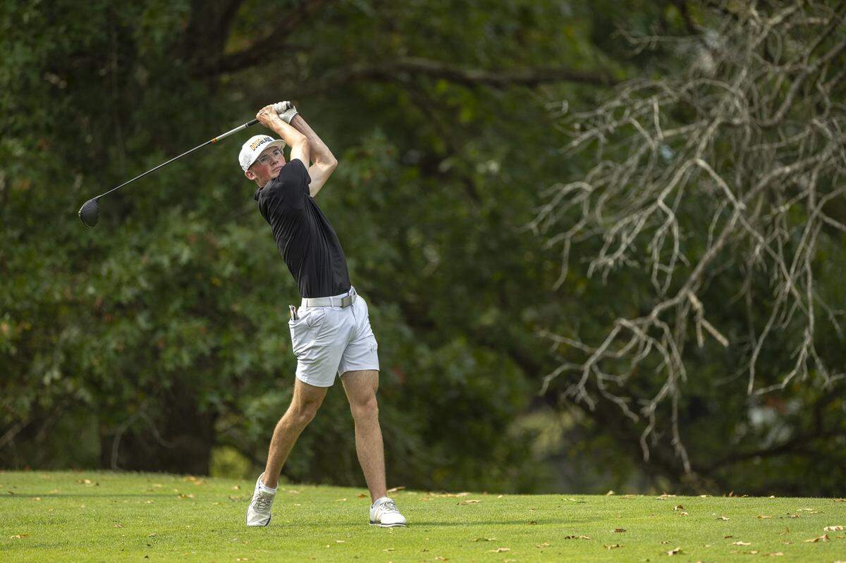 Ashton Gordon of Frederick Douglass hits the ball on hole 13 during the Boys 9th Region Championship golf tournament at the University Club at Arlington in Richmond, Ky., on Monday, Sept. 22, 2025.  