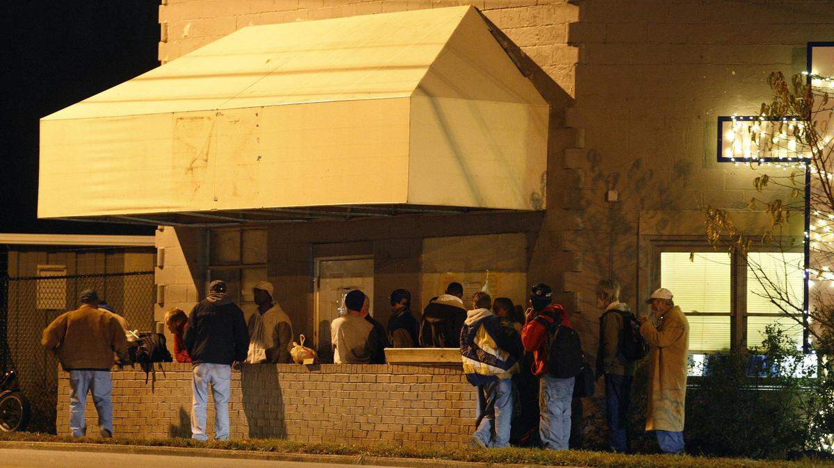 People lined up to wait to get into the Community Inn before it opened one night in 2013.