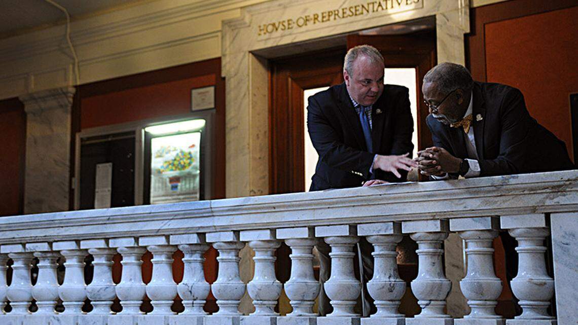 FRANKFORT, March 21, -- Rep. Jason Nemes, R-Louisville, confers with Sen. Gerald A. Neal, D-Louisville, outside of the House chamber.