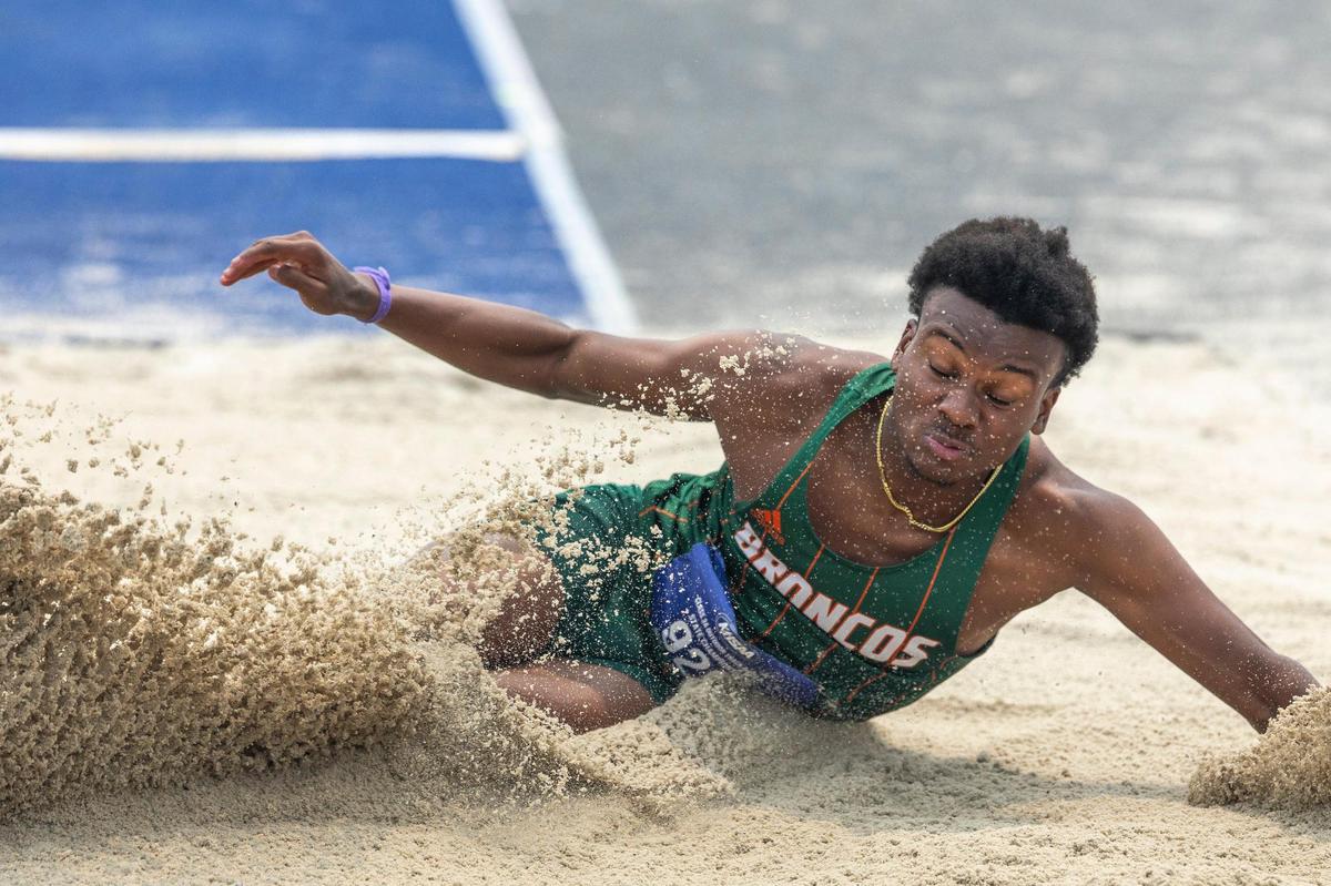 Malcolm Crow of Frederick Douglass competes in the long jump at the Class 3A state championships. Crow won a state title in the boys triple jump.