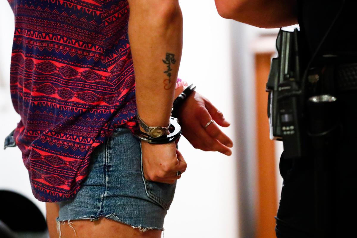 A woman is arrested for trafficking and position of methamphetamine and drug paraphernalia in a home on Lancelot Court in Pikeville, Ky., Thursday, Aug. 8, 2019.