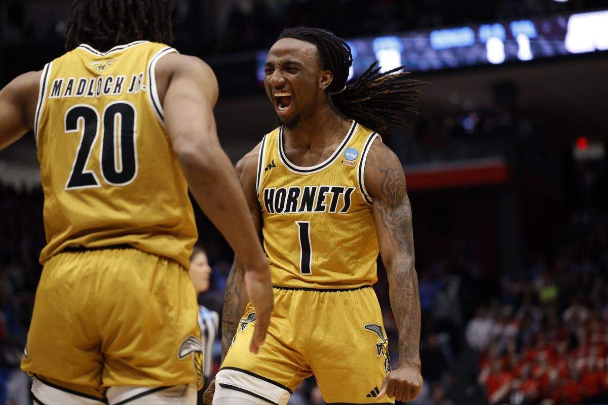 Mar 18, 2025; Dayton, OH, USA; Alabama State Hornets guard Amarr Knox (1) celebrates with guard TJ Madlock (20) in the second half against the St. Francis (Pa) Red Flash at UD Arena. Mandatory Credit: Rick Osentoski-Imagn Images