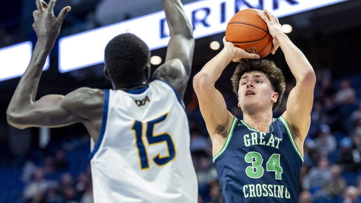 Great Crossing's Brady Orem (34) puts up a shot over Danville Christian's Geu Leek Ateny (15) during a first-round game in the 2026 UK Healthcare Boys' Basketball Sweet 16 state tournament, Wednesday, March 18, 2026 at Rupp Arena in Lexington, Ky.