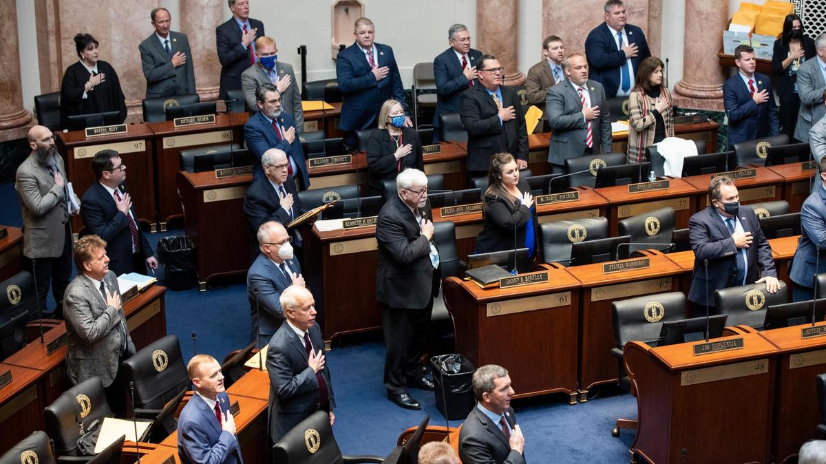 The Kentucky House of Representatives stands for the pledge of allegiance during the first day the Kentucky General Assembly 2022 session at the Capitol in Frankfort, Ky., Tuesday, January 4, 2022.