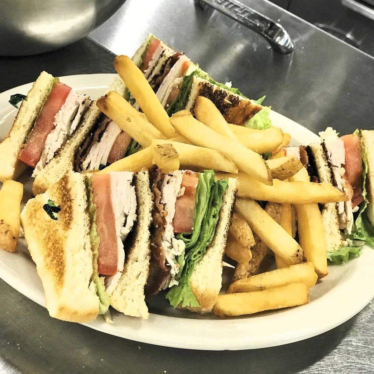 A.P. Suggins Club Sandwich is a favorite of diners at the Romany Road restaurant, which serves Southern comfort food.
