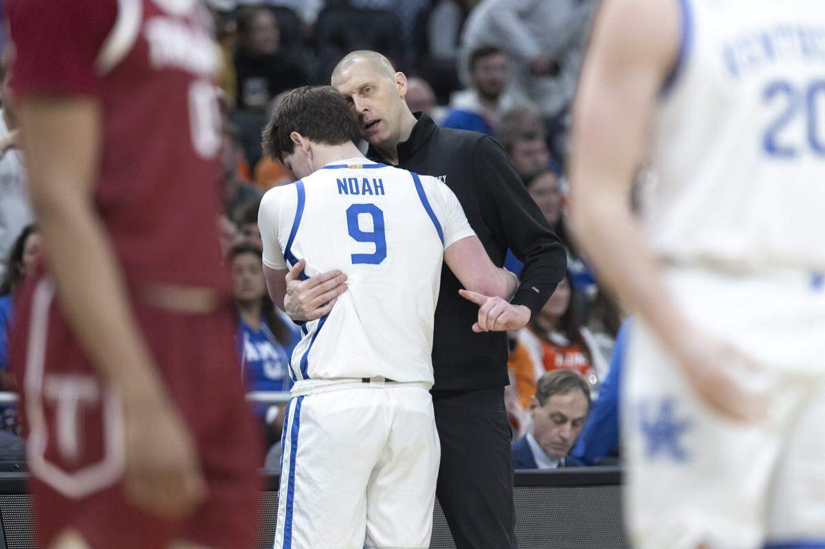 Kentucky head coach Mark Pope talks to forward Trent Noah (9) during a first-round NCAA Tournament game against Troy in Milwaukee on Friday.