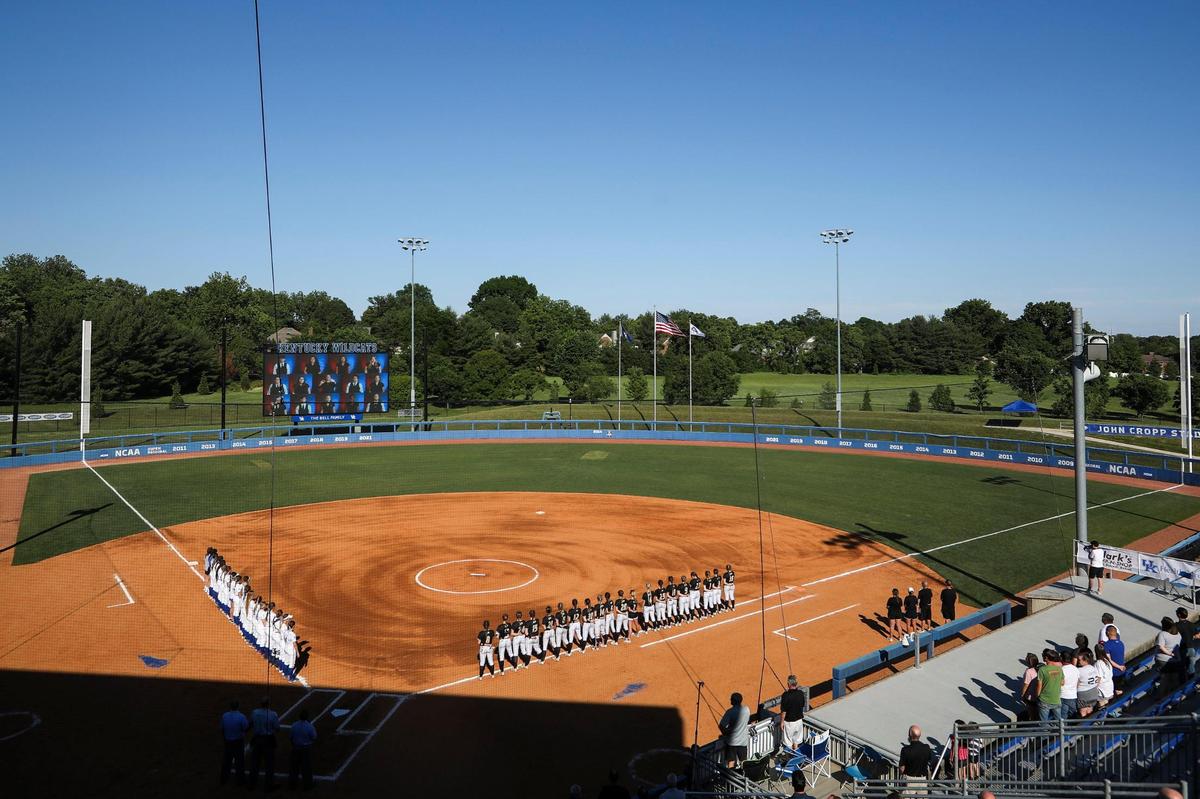 The Lexington Catholic Knights and the Boyle County Lady Rebels stand for the national anthem before their first-round game on Friday night.