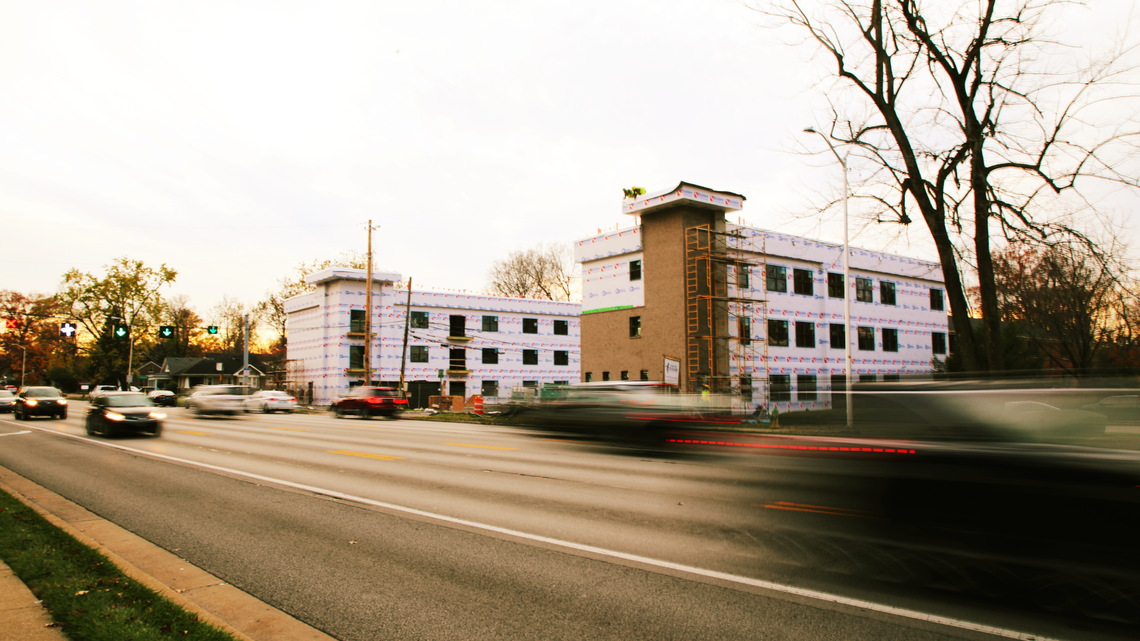 Cars drove by a 41-unit apartment complex under construction on Nicholasville Road in Lexington last November.
