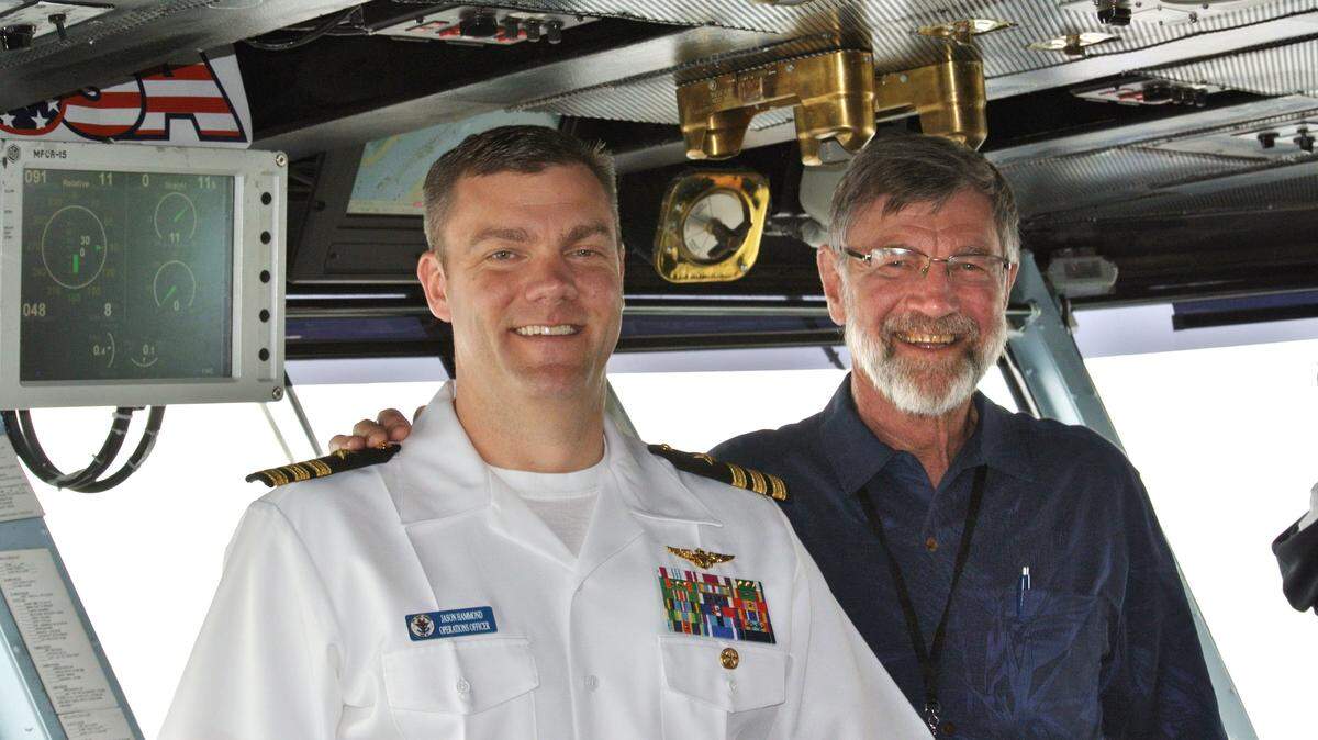 Ray Hammond, right, of Danville spent a week aboard the USS Carl Vinson with his son, Navy Cmdr. Jason Hammond, during a weeklong "Tiger Cruise" for sailors' families and friends in May. Jason Hammond is the ship's operations officer.        
