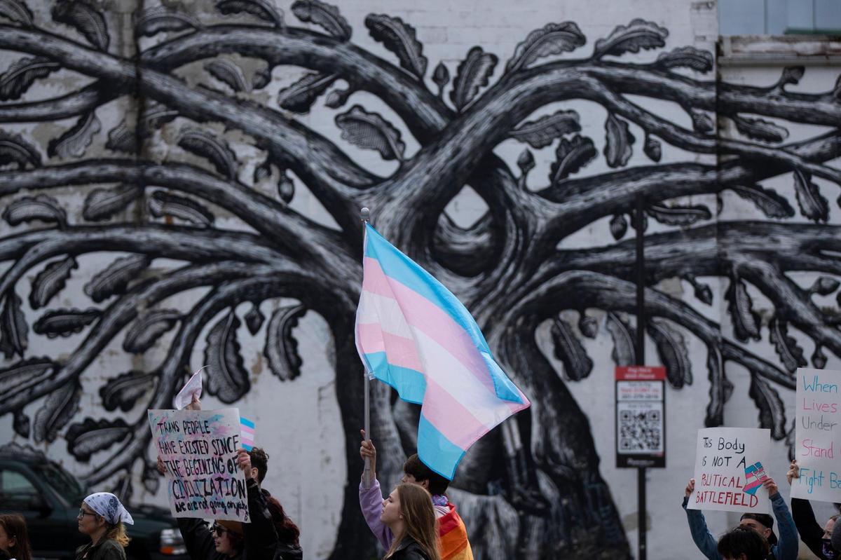 People gather for a rally organized by LGBTQ youth and adults in opposition to Senate Bill 150 and also to celebrate Trans Day of Visibility in Lexington, Ky., Friday, March 31, 2022.