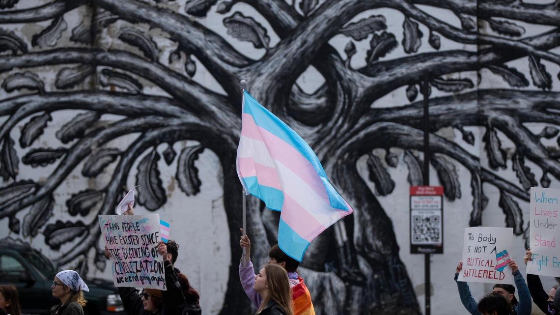 People gather for a rally organized by LGBTQ youth and adults in opposition to Senate Bill 150 and also to celebrate Trans Day of Visibility in Lexington, Ky., Friday, March 31, 2022.