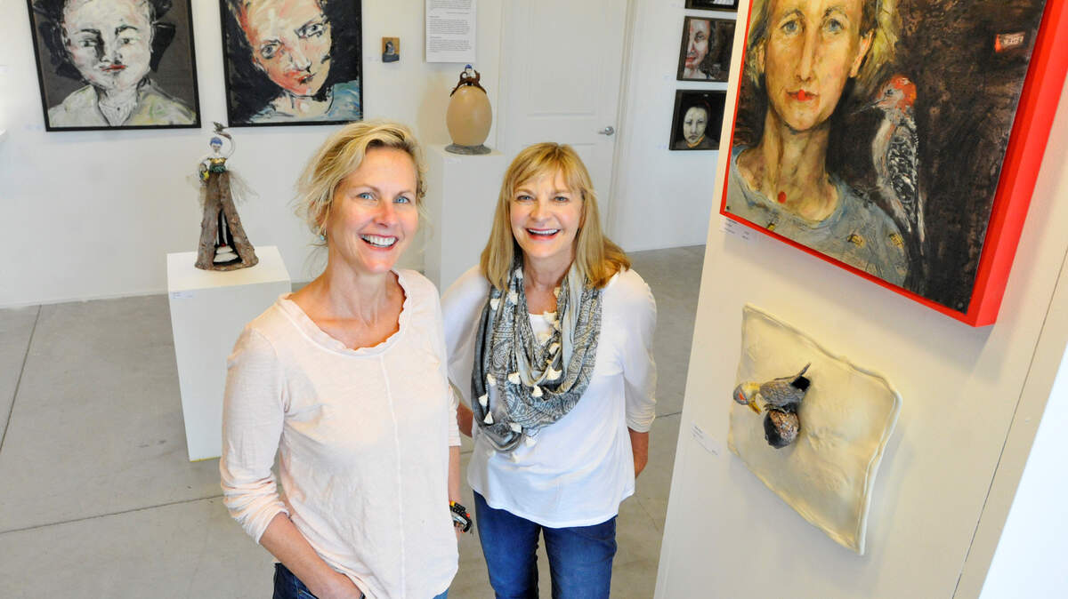 Lexington artists Georgia Henkel, left, and Gayle Cerlan, who have lived across the street from each other for 18 years, have collaborated on Strange Sympathies, an exhibit of their work, at the MS Rezny Studio Gallery.