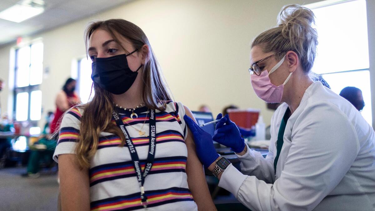Samantha Schnelle, 15, receives her first COVID-19 vaccination shot at STEAM Academy in Lexington, Ky., Thursday, May 13, 2021.