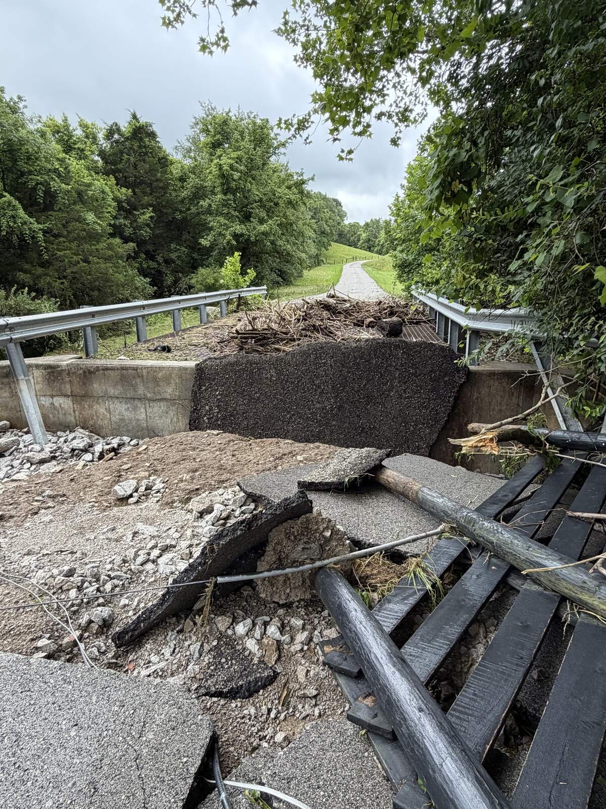 A residential driveway near Tates Creek Road in Madison County is destroyed as a result of Saturday flooding.