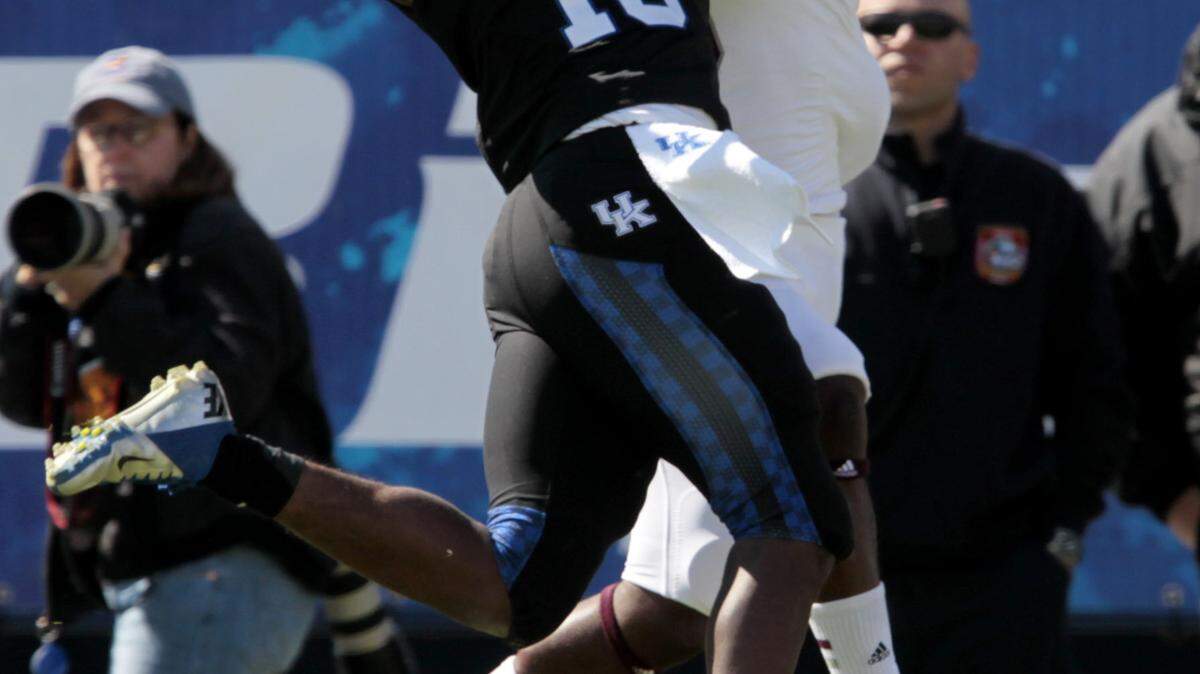 Kentucky's Cody Quinn (16) broke up a pass intended for Mississippi State's Brandon Heavens last season. Quinn has been out with an ankle injury.    